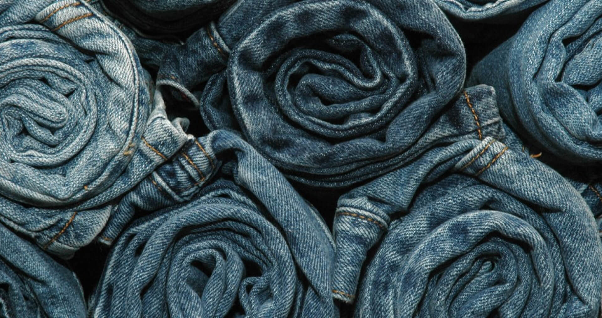 Stone wash grey jeans denim fabric close up photography, denim