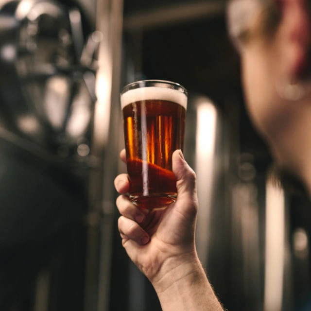 Brewmaster checking his beer innovation