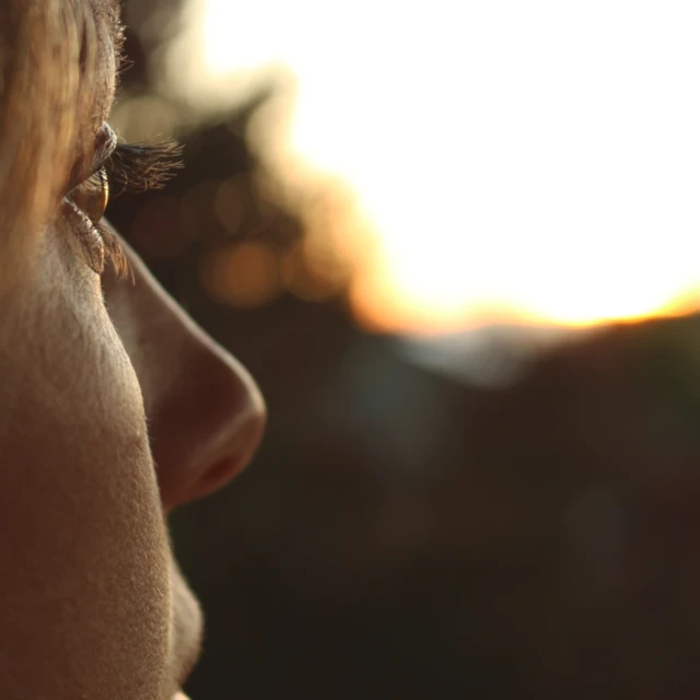 Woman looking at sunrise