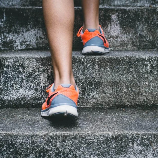 Person going up some stairs