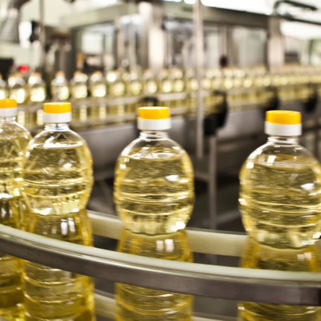 Bottled oil on assembly line