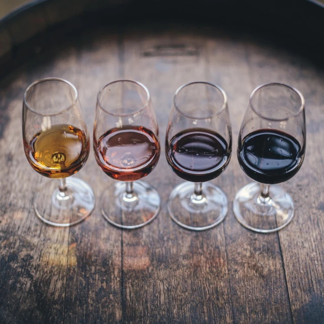 wine glasses on top of a cask