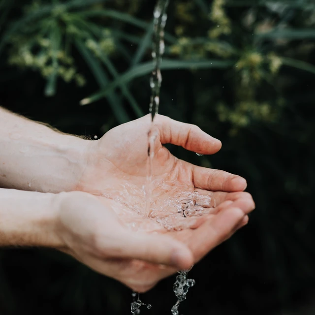 Hands holding clean water