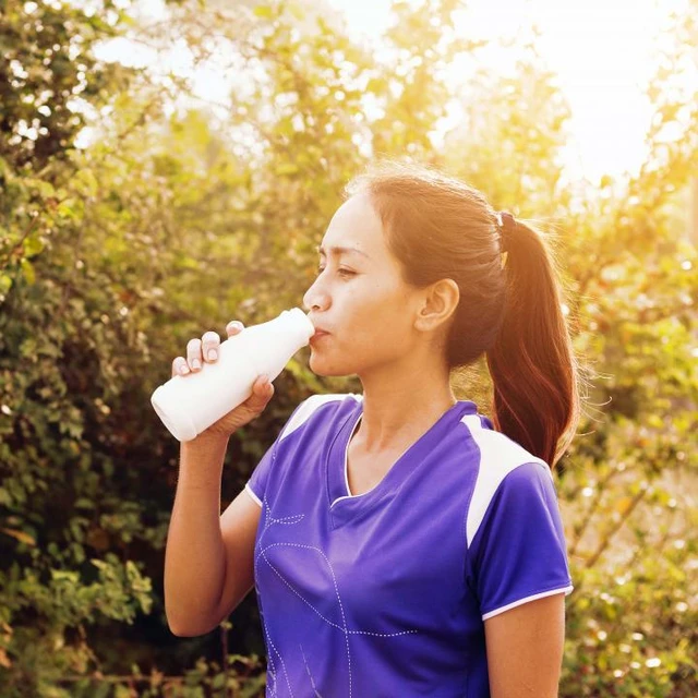 woman drinking a sports-drink