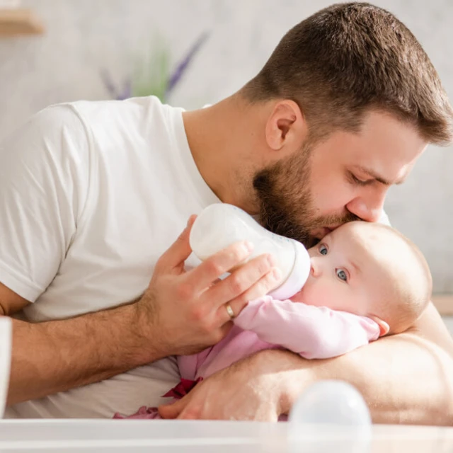 father_giving_baby_baby_infant_formula