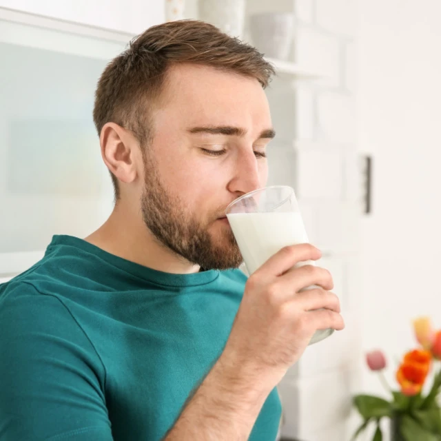 man drinking fresh milk