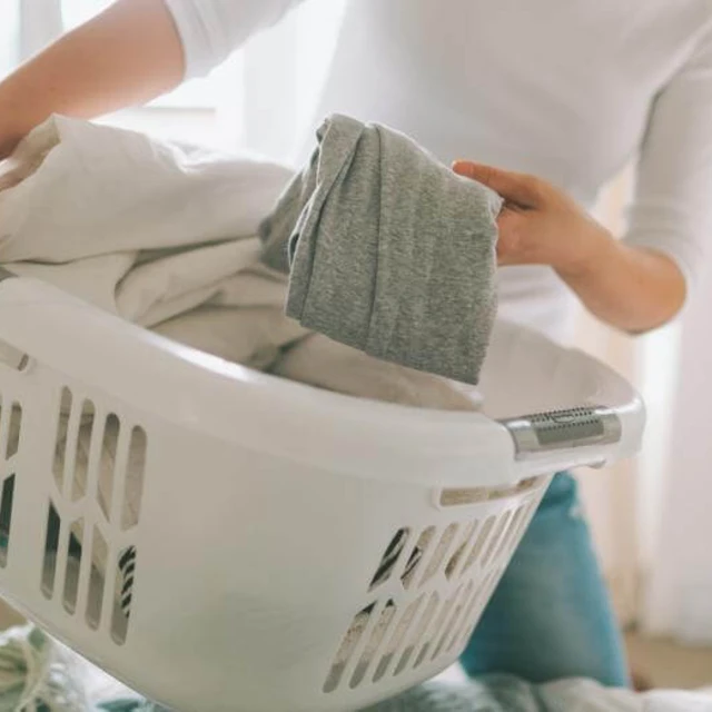 woman carrying laundry basket