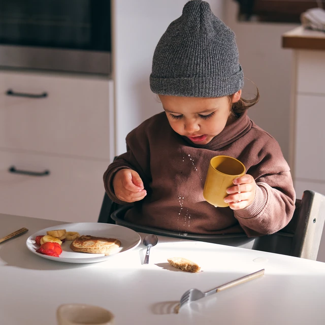 Kid spilled dairy drink on shirt