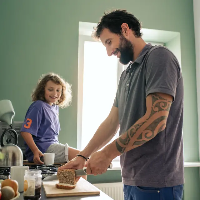 Man cutting a slice of nutritious loaf