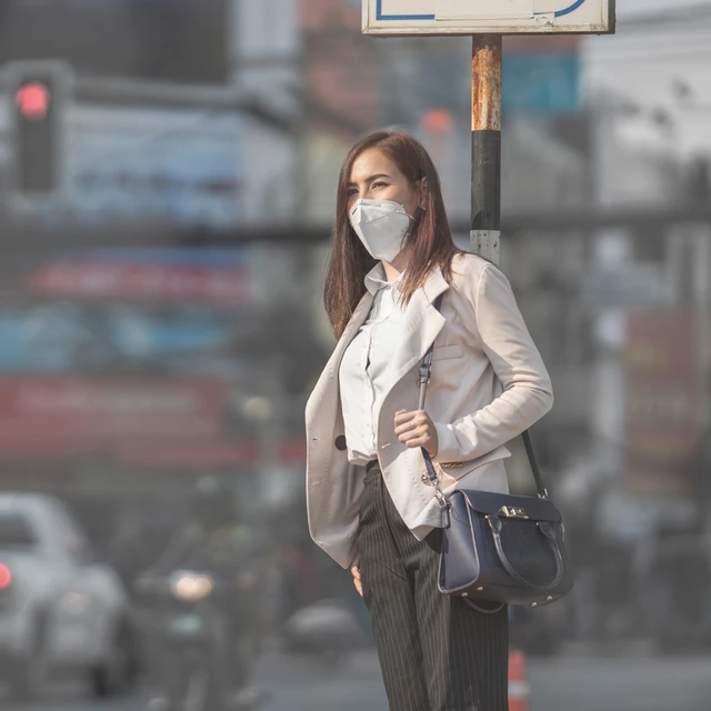 Woman in fast-paced city urban grime