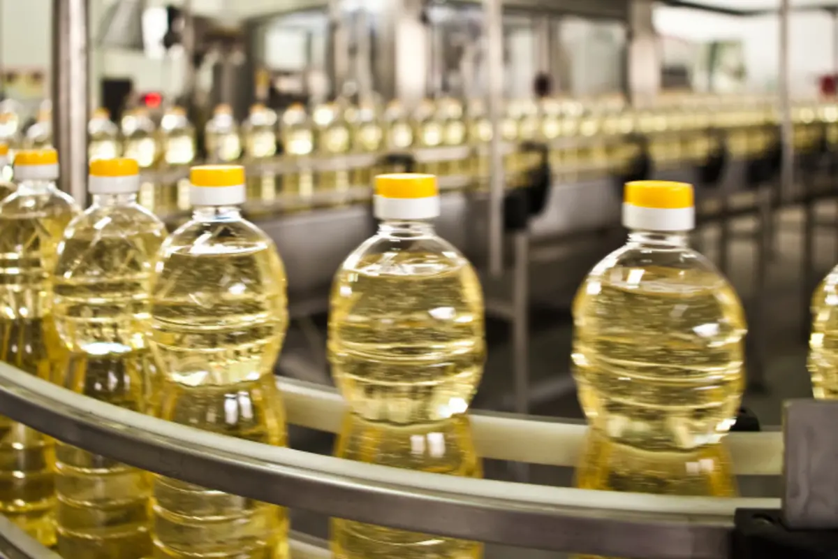 Bottled oil on assembly line
