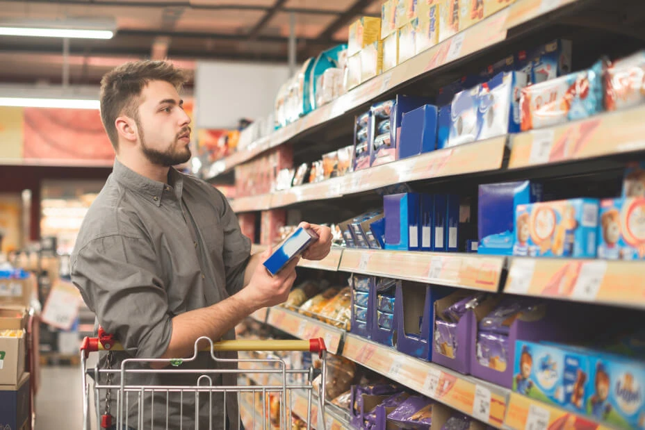 man looking at cookies and biscuits