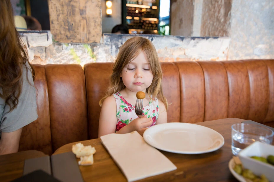 kid eating potato