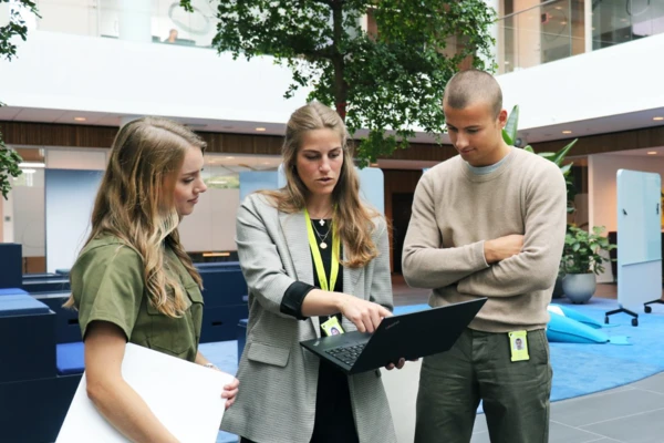 Graduates listening to a mentor