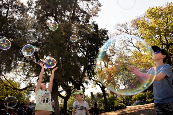 kids playing with soap bubbles