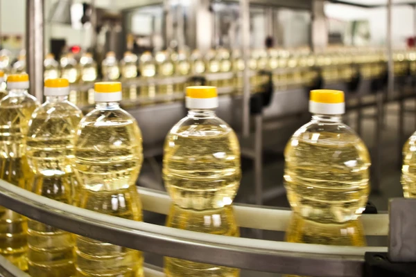 Bottled oil on assembly line