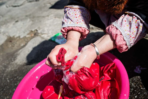 Person hand-washing clothes