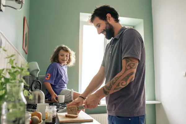 Man cutting a slice of nutritious loaf