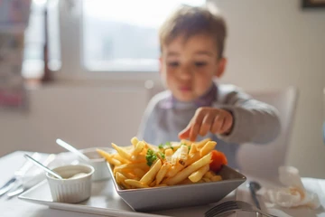 Boy eating fries