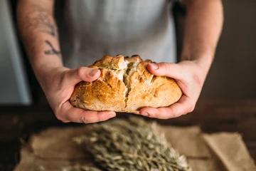 baker with gluten-free bread