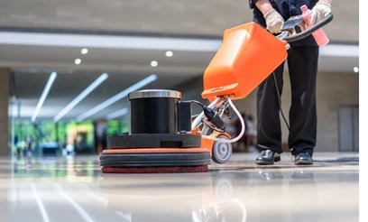 Cleaning worker cleaning floor in an officespace